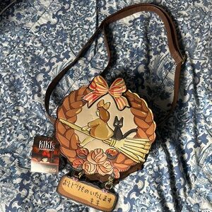 Artistic Brown and Black Crossbody Bag with Floral Design